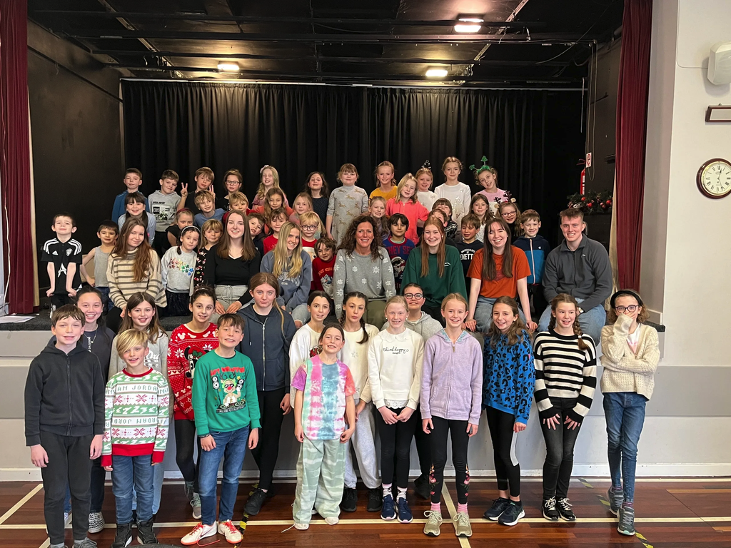 Holiday Club group photo on stage
